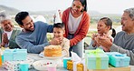 Happy family, birthday and singing with applause at party for boy child with grandparents, mom and dad at celebration. Men, women and children in group, love and present for event at house on holiday