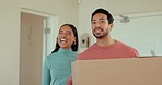 Happy, moving and young couple with a box  for their new house, apartment or real estate. Happiness, smile and people talking, laughing and bonding with a cardboard package or parcel in their home.