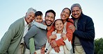 Happy, laugh and face of a big family bonding in an outdoor park while on a weekend trip. Happiness, smile and portrait of children with their parents and grandparents in garden in nature on holiday.