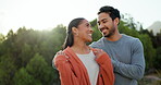 Couple, talking and walking at a park outdoor with love, happiness and care in summer. A young man and woman happy together on an adventure, travel and romantic stroll for conversation or to relax