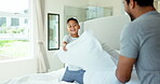 Pillow fight, happy father and kid play in bedroom with energy, funny games and joke together at home. Excited boy child, dad and laughing with pillows, crazy morning and quality time with family