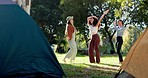 Camping, energy and girl friends dancing together in a forest in nature to music, playlist or album. Happy, freedom and young women moving and jumping to song in the outdoor woods on a weekend trip.