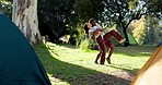 Nature, camping and young couple dancing together in a forest to romantic music, playlist or album. Happy, love and man and woman moving to a song on a date in the outdoor woods while on weekend trip