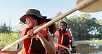 Couple, kayak and rowing on a lake in nature for sports challenge, adventure or travel with a smile. Young man and woman friends together on boat and water for fitness, travel and holiday for freedom