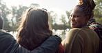 Happy, face and woman with friends on lake, camping in nature or group laughing and bonding on outdoor picnic at the park. Portrait, smile and girl relax in conversation or social gathering in woods