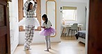 Mom, girl ballerina and dancing in house for dancing, support or happy for teaching, play or laugh. Ballet student, mother and daughter in clothes, start or tutu in funny game, bonding or family home