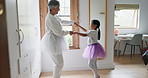 Dance, ballet and teaching with grandmother and child for support, princess and love. Happiness, music and care with old woman and young girl dancing in family home for learning, ballerina and trust