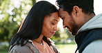 Couple, laughing and hug outdoor at a park in nature with love, care and commitment in marriage. Face of a young man and woman together for happiness, adventure or travel for freedom and relax