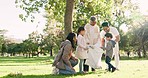 Happy family, volunteer and cleaning park for eco friendly environment in nature together outdoors. Parents, grandparent and children helping to save plant or earth from pollution or waste outside