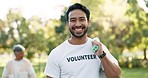 Cleaning, happy volunteer and man in park with litter for community service, recycling and sustainability. Eco friendly, charity and portrait of male person with bag for trash, plastic and pollution