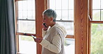 Senior woman, talking and cellphone with credit card for payment in home with discussion about service. Conversation, online and order with elderly woman for delivery on app with tech for courier.