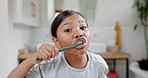 Face of girl, child and brushing teeth in bathroom for dental wellness, morning routine and healthy habits. Portrait of young kid cleaning mouth with toothbrush, self care and fresh breath at home