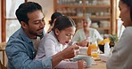 Family, breakfast and father feeding girl cereal at home in the morning together. Dad, mother and child eating food for nutrition, healthy diet and wellness for growth with care of happy parents.