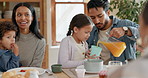 Family, breakfast and father pouring juice for girl at home in the morning together. Dad, mother and child with orange drink for nutrition, healthy diet and wellness, growth and care of happy parents