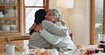 Hug, women and excited celebration at breakfast in a family home at table for announcement. Mother, people or friends together in dining room with love, care and conversation about food or good news