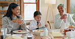 Family breakfast with mother, daughter and grandmother eating food together at home in the morning. Kids, love or funny with a young woman, child and parent in the living room, bonding over a meal 