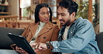 Happy, talking and an interracial couple with a tablet on the sofa for social media or internet. Smile, house and a young man and woman speaking while typing and reading on technology for news