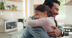 Family, daddy and daughter hug in the kitchen for love, trust or bonding together in their home. Kids, smile and safety with a happy young man parent embracing his adorable girl child in their house