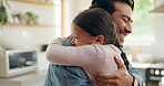 Children, father and daughter hug in the kitchen for love, trust or bonding together in their home. Family, smile and safety with a happy young man embracing his adorable girl child in their house