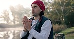 Camping, meditation and zen, man at lake on winter morning adventure and travel in nature with peace. Forest, prayer and hiker in calm landscape, freedom and vacation in trees with gratitude to relax