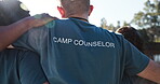 Camp counselor, group or people outdoor in nature for community service volunteer adventure in woods. Back of men and women at a lake and forest environment for camping, hike and freedom on travel 