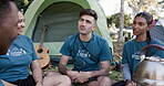 Camping, planning and volunteer friends talking outdoor while together on an outreach for the community. Team, discussion and a group of young people sitting on their campsite for charity or activism