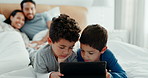 Brothers, children and tablet with parents on bed for game, movies or relax together with mom, dad and laugh. Happy family, boy kids and digital touchscreen for app, learning or development in home