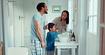 Parents, child and brushing teeth in family home bathroom while learning or teaching dental hygiene. A woman, man and kid with toothbrush and toothpaste for health, cleaning mouth and wellness