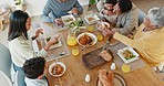 Food, big family and eating together from above, generations in dining room bonding and celebrate at table. Grandparents, parents and children sharing lunch, dinner and drinks in apartment in Mexico.