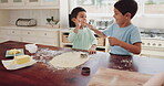 Kid, together and bake with high five in kitchen with dough or tools for skill with learning. Cookies, sibling and happy with flour in home or winning with target or success for bond in childhood.