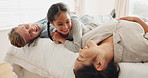 Happy family, bed and child laughing in a bedroom with mother and father for bonding with happiness together. Happy, funny and crazy kid with love or care for mom and dad in the morning at home