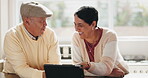 Tablet, meme and senior couple laughing together about web, online or website joke bonding and enjoy retirement in home. Technology, app and elderly people in a kitchen or man and woman streaming