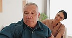 Senior couple, argument or divorce in disagreement, conflict or fight on living room sofa at home. Upset elderly man ignoring woman in toxic marriage, cheating affair or infertility on couch in house