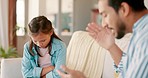 Angry father scolding his girl child in the living room of their family home for conflict. Upset, moody and young dad speaking loud, reprimanding or punishing kid for bad behavior on a sofa in house.