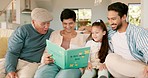 Grandparents, girl child and book on sofa for reading, learning and happy story with care, bonding and love. Dad, senior man and woman with kid, fairytale and teaching for education in family house