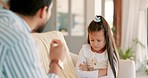 Upset father with his girl child for punishment in the living room of their family home for conflict. Angry, moody and young dad speaking loud or scolding his kid for bad behavior on a sofa in house.