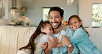 Father, couch and hug with kids and parent care in a home with a smile from family love. Children, happy and dad won a lounge sofa in a living room with support and having fun together with youth