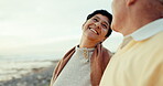 Senior couple, love and outdoor at the beach with a smile, happiness and love or care on holiday. A happy woman and man in retirement for freedom, vacation or commitment to marriage at the ocean