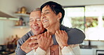 Love, senior couple and hug in home, happy and bonding together for romance. Smile, elderly man and woman embrace, funny laugh and enjoying quality time in retirement with care, affection and support