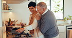 Cooking, love and a senior couple in the kitchen together, bonding while in their home to prepare a meal. Smile, food or dinner with a happy old man and woman getting cuisine ready for nutrition