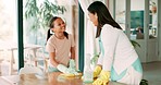 Happy, help and a child cleaning with a mother, learning and wiping a living room table in a house. Smile, family and a young mom and girl kid working and helping to clean a desk in a home together