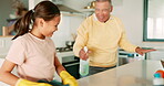 Dance, kitchen and a girl cleaning with her grandfather while having fun in the home together during chores. Family, kids and housework with a senior man teaching his grandchild about responsibility
