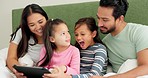 Mother, father and children with a tablet on bed in a family home for education, games and e learning. Man, woman and excited kids in bedroom with technology wow for development, streaming or movies