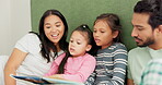 Family, bed and reading a book at home for learning, quality time and bonding in morning. A man, woman or parents and girl kids in a bedroom together for a story, education and development with love