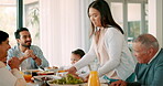 Thanksgiving, roast and a woman serving her family while in celebration of a holiday together. Love, lunch or brunch with a mother carrying a roast to the dining room table while bonding over food