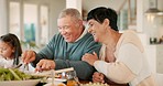 Happy senior couple, talk and family dinner with love, bonding and funny chat at table in home. Elderly man, women or kid with food, lunch and hug with care, relax and together at house in Jakarta