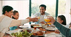 Thanksgiving toast with children, parents and grandparents together as a family for bonding in celebration. Love, brunch or cheers with kids and relatives eating food at the dining room table