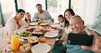 Thanksgiving selfie with a grandfather and his family together for bonding or eating food in celebration. Love, lunch or brunch with a happy senior man taking a photograph at the dining room table