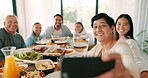 Thanksgiving selfie with a senior woman and her family together eating food for bonding in celebration. Love, lunch or brunch with a senior woman and relatives taking a picture in the dining room