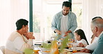 Thanksgiving, food and a father serving his family while eating food for bonding in celebration. Love, lunch or brunch with a man carrying a dish to the dining room table during a holiday event